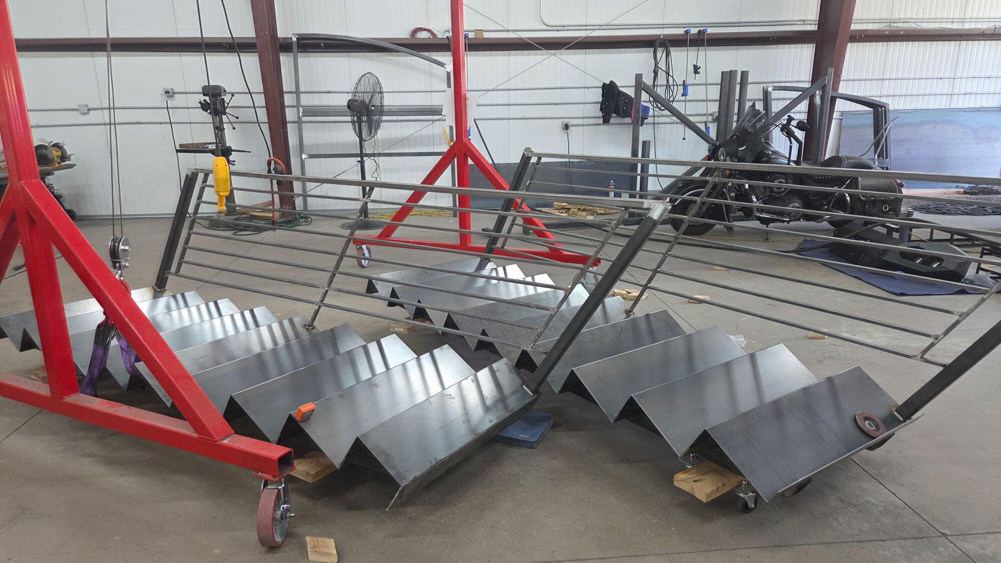 Custom staircase under construction by Jason Pedersen of Titan Forge LLC, showcasing expert metal fabrication and precision welding in Springville, Utah.